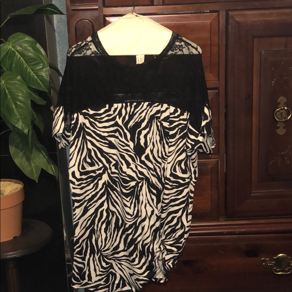 Zebra print blouse with lace shoulders